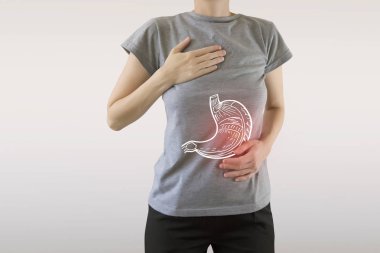 Digital composite of highlighted painful stomach of woman  clipart