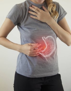 Digital composite of highlighted stomach of woman clipart