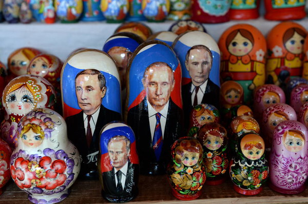 MOSCOW, RUSSIA JULY 7, 2018:Souvenirs-matryoshka dolls with the image of Russian President Vladimir Putin on the counter of Souvenirs in Moscow