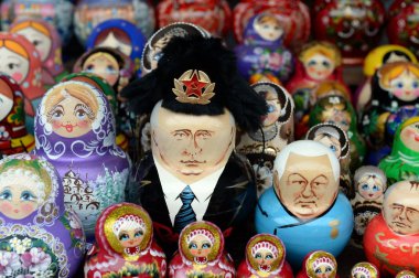 MOSCOW, RUSSIA JULY 7, 2018: Nesting dolls depicting Russian presidents Vladimir Putin and Boris Yeltsin on the counter of Souvenirs in Moscow. clipart