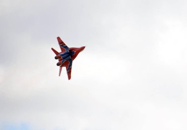  Multipurpose highly maneuverable MiG-29 fighter from the Strizhi aerobatic team over the Myachkovo airfield clipart