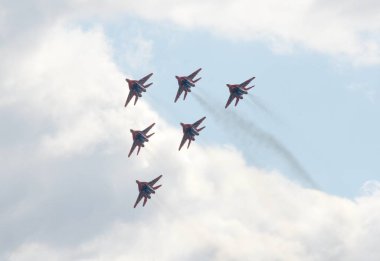   Performance of the Swifts aerobatic team on multi-purpose highly maneuverable MiG-29 fighters over the Myachkovo airfield clipart