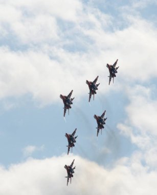   Performance of the Swifts aerobatic team on multi-purpose highly maneuverable MiG-29 fighters over the Myachkovo airfield clipart