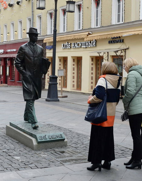  Tourists at the monument to the composer Sergei Prokofiev in Kamergersky lane in Moscow