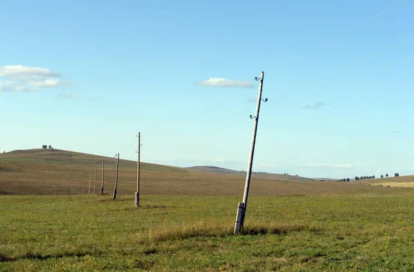 Power line in the foothills of the Altai territory. Western Siberia. Russia — Stock Photo, Image