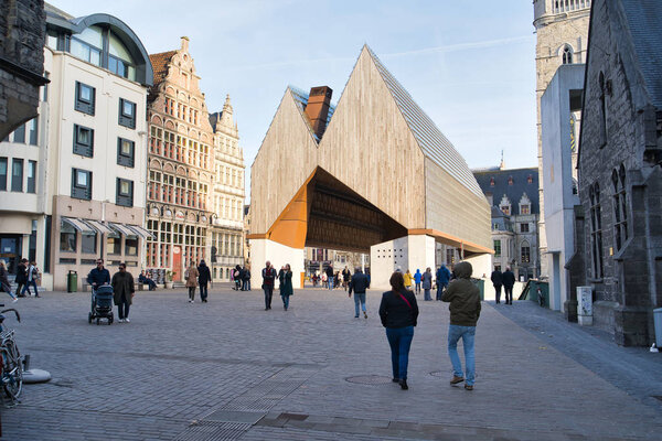 GENT, BELGIUM - FEBRUARY 17, 2019: The building of the Stadshal in the most prominent place in the city center. The roof of the building is made of wood, glass and concrete.