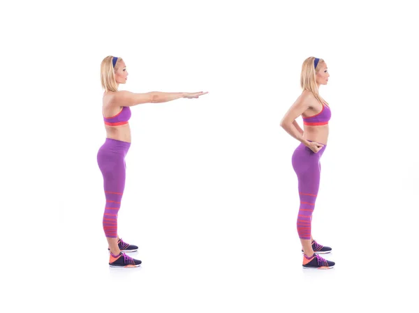 Красивая молодая беременная женщина делает упражнения на белом фоне. Ранняя беременность . — стоковое фото