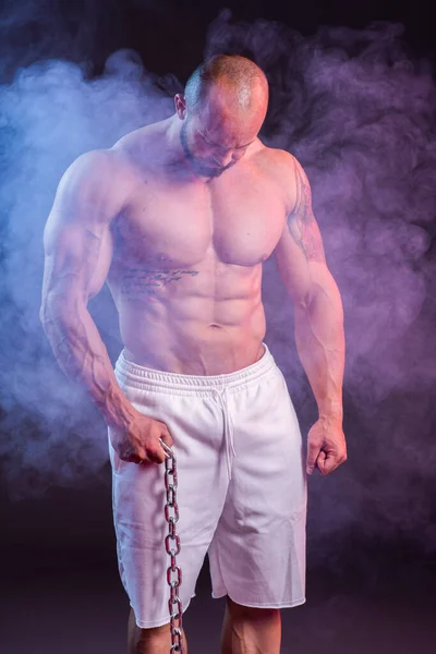 Powerful Muscular Man Shirtless Posing Chain Studio Shoot Red Blue — Stock Photo, Image