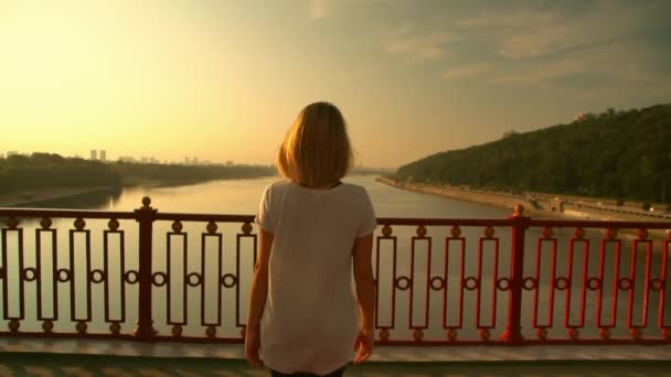 Woman is spreading her hands against the sky — Stock Video