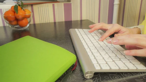 Female hands fast typing on the keyboard