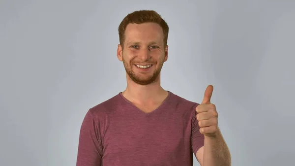 Ginger male shows sign approval — Stock Photo, Image