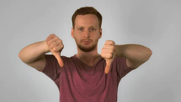 Ginger male shows sign approval and disapproval — Stock Photo, Image