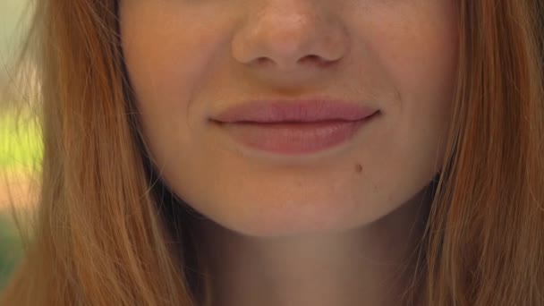 Close up lower face ginger girl laughing — Stock Video