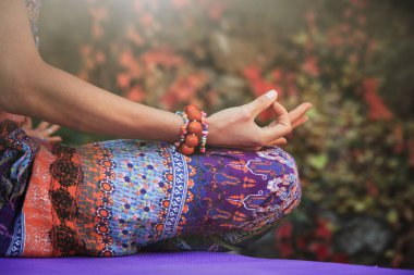 woman practice yoga meditation hands in mudra gesture closeup outdoor autumn day clipart