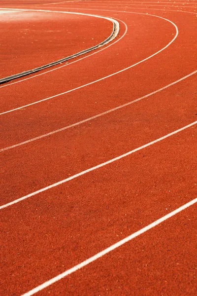 Athletic red running tracks whit white line — Stock Photo, Image