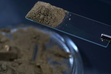 Chemical powder from the chemistry kit with macro lens photographed in studio clipart