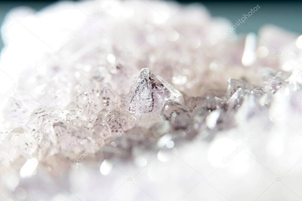Quartz also called deep quartz with mineral inclusions in the studio in front of black background photographed in Marco mode 