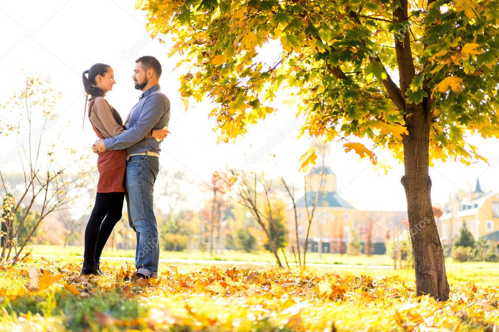 couple in love walking in autumn park