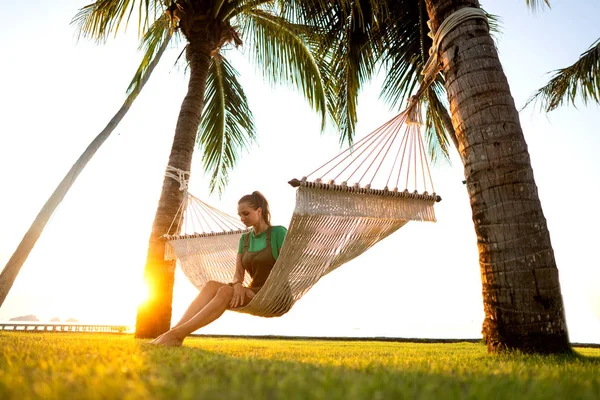 Hammock on tropical palm trees overlooking the mountains — Stock Photo, Image