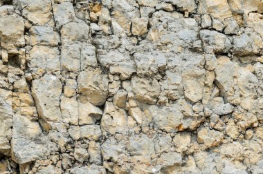 Dokulu taş doğal kaya duvarı formunda moloz balast arka plan