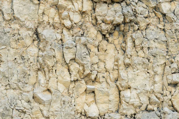 Dokulu taş doğal kaya duvarı formunda moloz balast arka plan