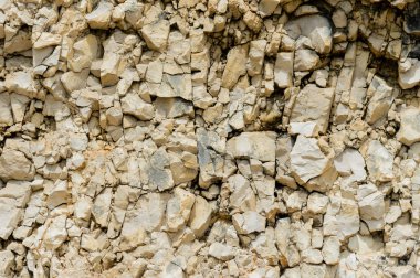 Dokulu taş doğal kaya duvarı formunda moloz balast arka plan.