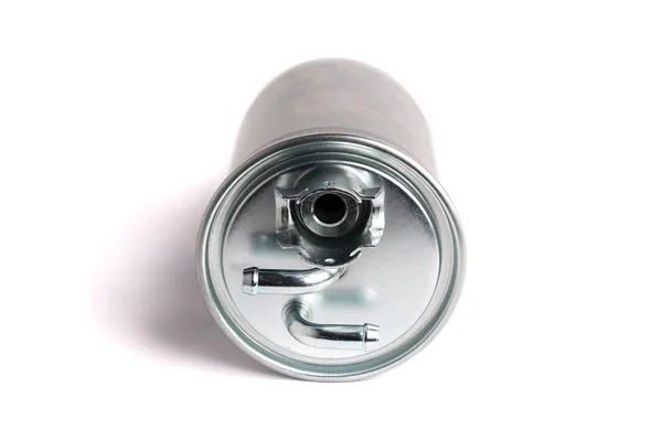 A new fuel filter enclosed in a metal casing with an inlet and outlet on fuel lines on a white isolated background — Stock Photo, Image