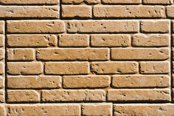 En bricka som imiterar en murverk i beige färg. Texturerat bakgrund — Stockfoto