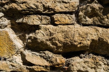 Eski taş tuğla duvarlar doğal toz örümcek ağı ile taş ve çamur dokulu arka plan