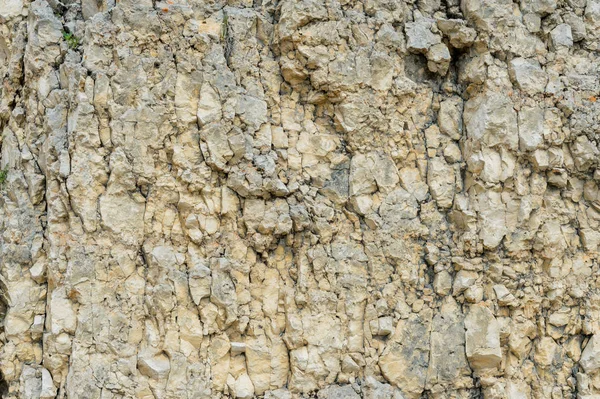 Kamienia teksturowanej tło gruzu balastu w postaci naturalnej w skalnej ściany — Zdjęcie stockowe