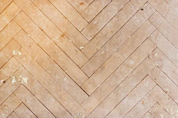 A close-up of an old faded parquet covered with dust and dirt. Result of repair. Cleaning and cleaning required — Stock Photo, Image