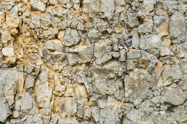 Dokulu taş doğal kaya duvarı formunda moloz balast arka plan