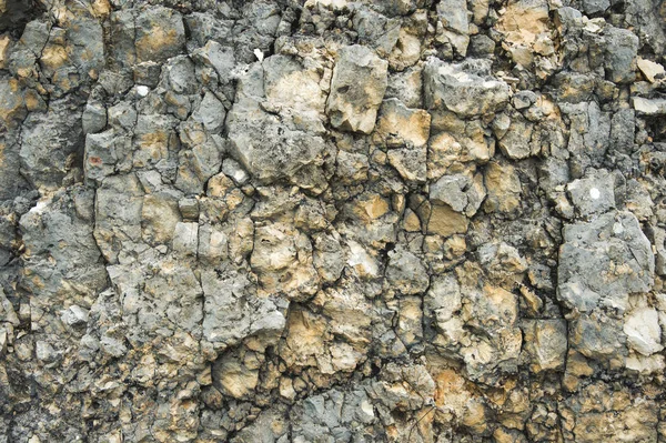 Fondo in pietra strutturato Zavorra di macerie in forma naturale nella parete rocciosa — Foto Stock