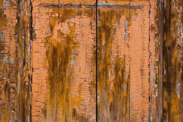 Old boards with cracked rusty paint. Textured wooden old background with vertical lines — Stock Photo, Image