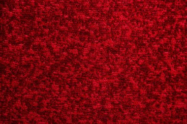 Koyu kırmızı halı doku. Degrade ışık yakın çekim