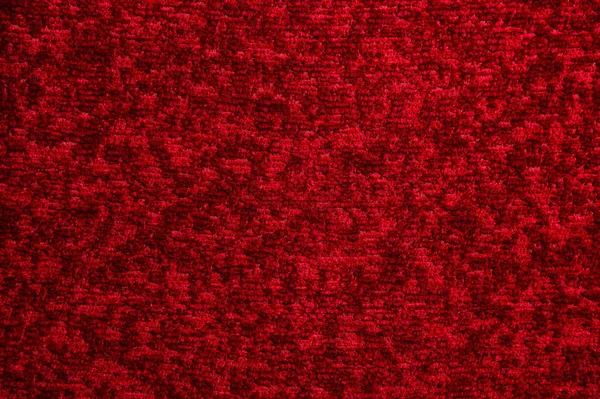 Koyu kırmızı halı doku. Degrade ışık yakın çekim