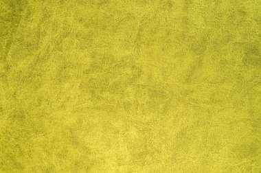 Sarı kadife kumaş yüzeyinde üst desenli. Yapay bez dokusu