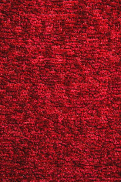 Tekstura ciemny czerwony dywan. Zbliżenie światło gradientu — Zdjęcie stockowe