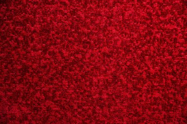 Koyu kırmızı halı doku. Degrade ışık yakın çekim