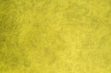 Sarı kadife kumaş yüzeyinde üst desenli. Yapay bez dokusu