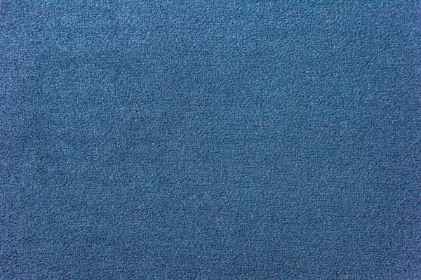 Текстура тёмно-синего ковра. Крупный план градиентного света — стоковое фото