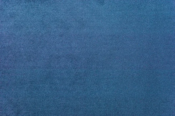 Textura de una alfombra azul oscuro. Primer plano de la luz de gradiente —  Fotos de Stock