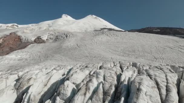 Arial view glaciers on the sleeping Elbrus volcano. Vertical camera movement. North Caucasus Russia — Stock Video