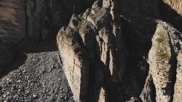 Aerial view of structured rocks with crumbling debris. Cellular rocks. Stone remains of silicon trees. Russia Northern Caucasus — Stock Video