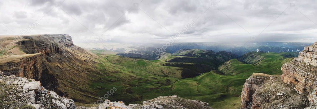 Panoramic view of the Kanjol Plateau with its high cliffs and the valley located at its foot. North Caucasus. Russia