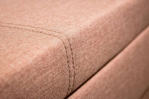 Detail fragment drahé béžové textilní pohovka v pokoji — Stock fotografie