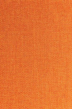 Dokulu arka plan yüzeyi Tekstil döşemelik mobilya yakın çekim. Turuncu renk kumaş yapısı