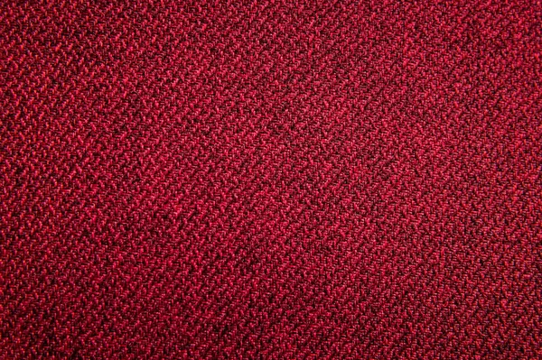 Текстурована фонова поверхня меблів з текстильної оббивки крупним планом. червоний колір структури тканини — стокове фото