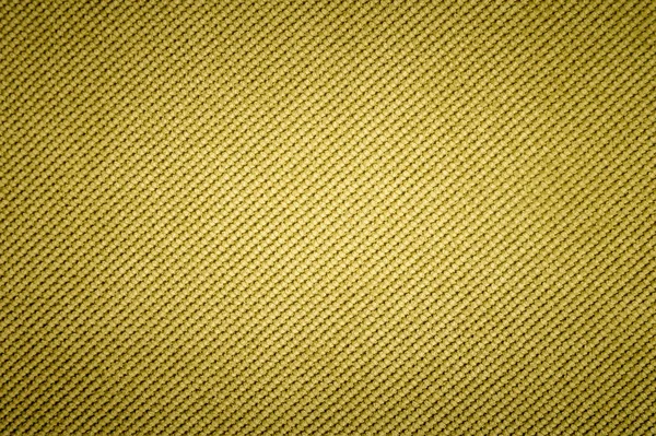 Текстурированная задняя поверхность мягкой мебели крупным планом. Желтая ткань — стоковое фото