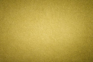 Dokulu arka plan yüzeyi Tekstil döşemelik mobilya yakın çekim. sarı renk kumaş yapısı